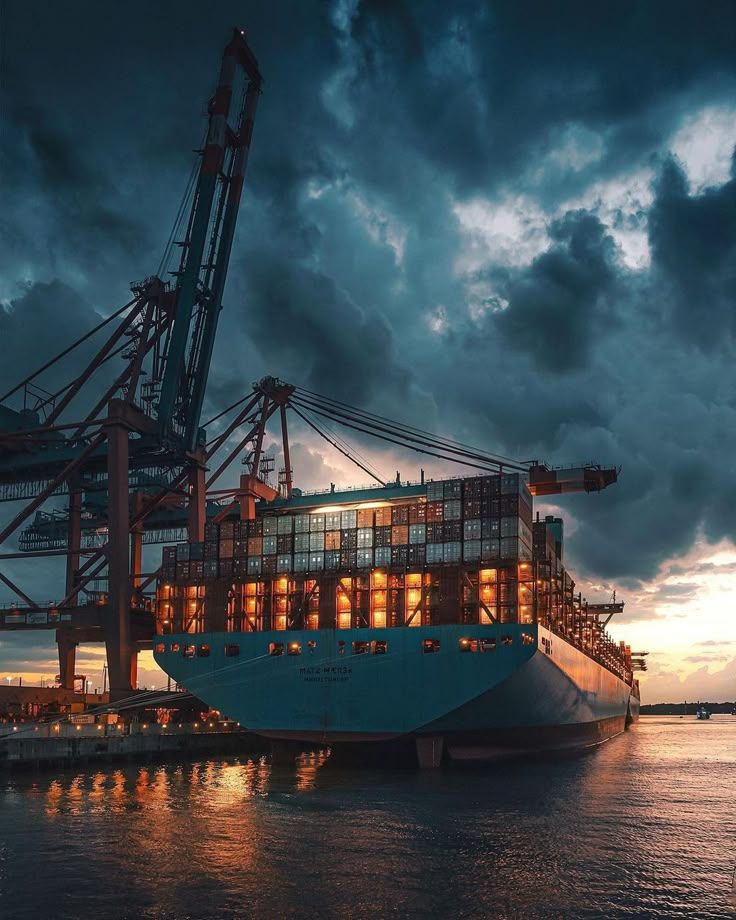 Container vessel loading at the terminal at dusk
